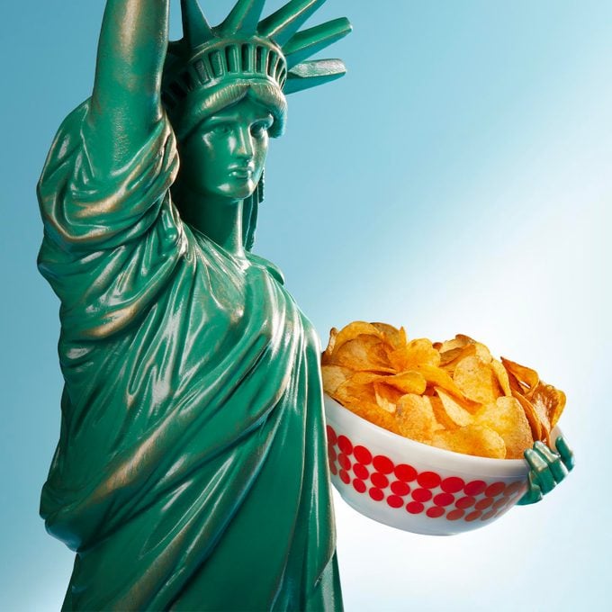 Statue of Liberty holding a bowl of fried pork skins
