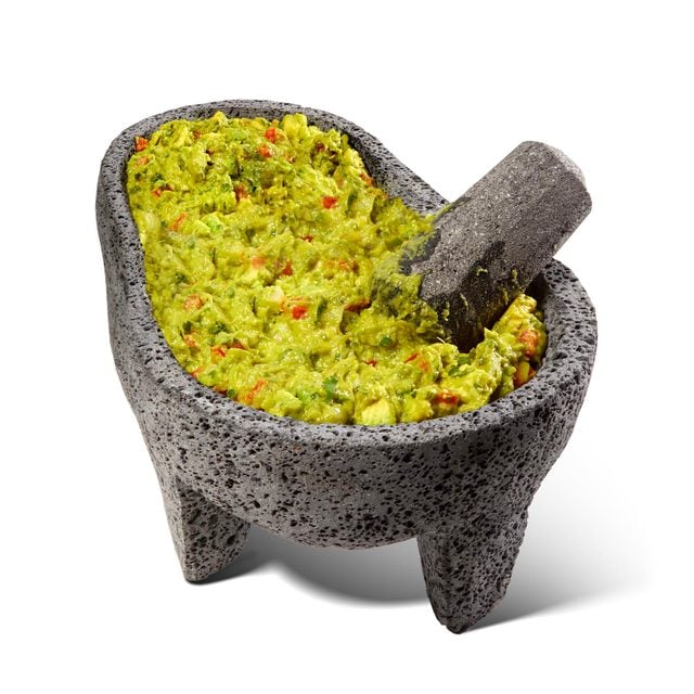 Guacamole in an avocado shaped molcajete