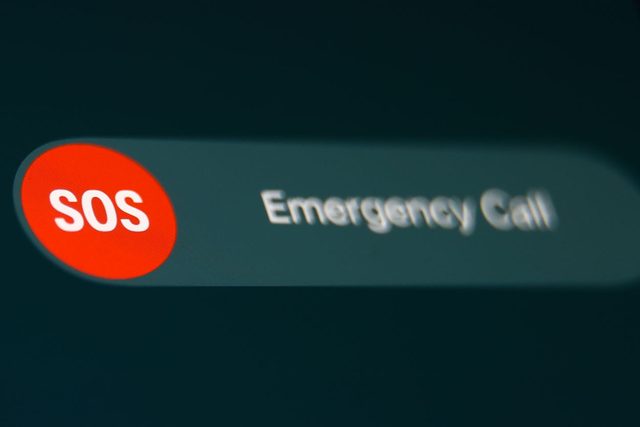 SOS Emergency Call sign displayed on an iPhone screen