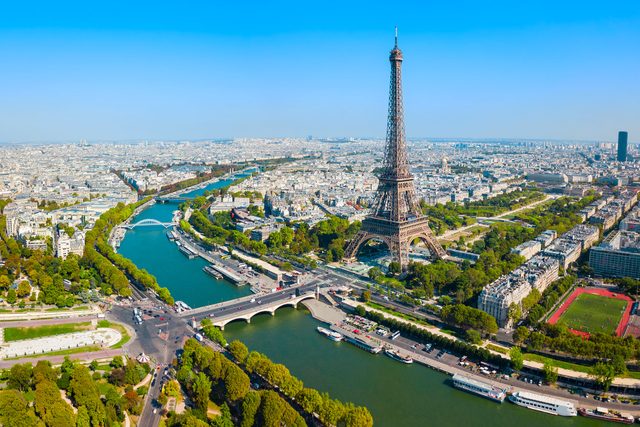 Aerial View of Paris, France with the Eiffel Tower in the background on a sunny day