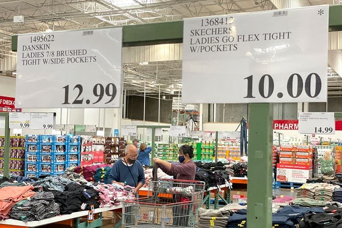 Customers shop for clothing at a Costco store in Novato, California