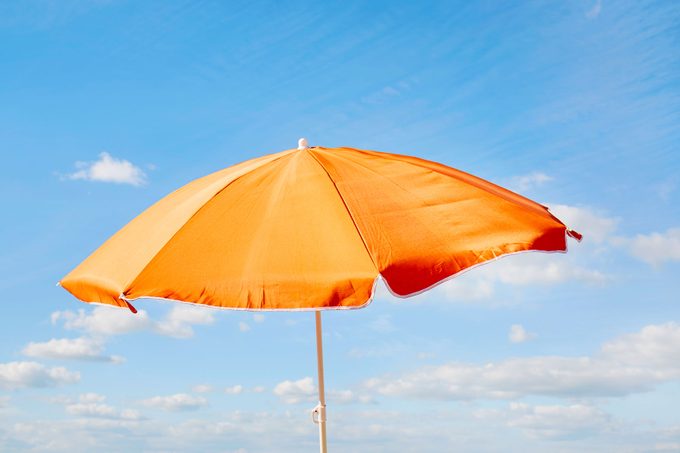 Orange Parasol Against Blue Sky