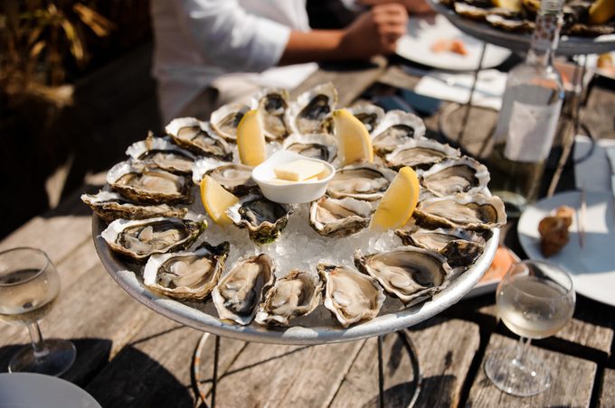 Tasty oysters on the plate on the table