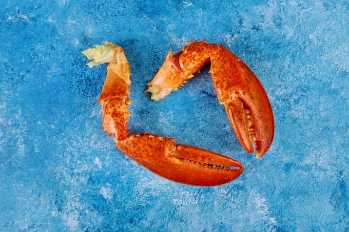 lobster claws on a blue table