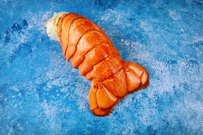 Lobster tail on a blue table