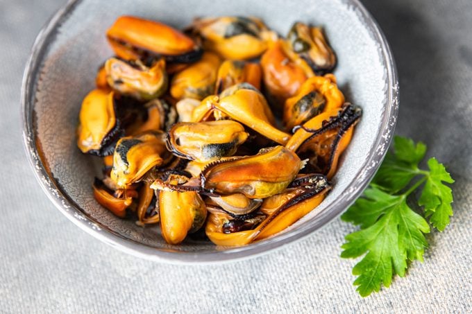 fresh mussels peeled seafood meal on the table copy space food background rustic