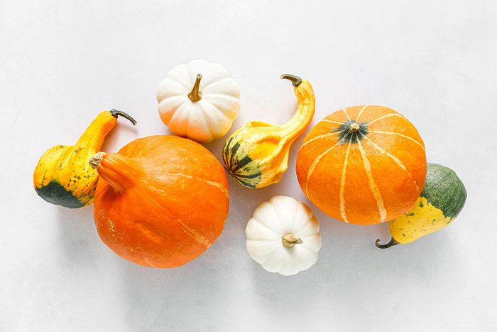 Pumpkins on white background. Autumn, fall, thanksgiving or halloween concept, flat lay, top view, copy space