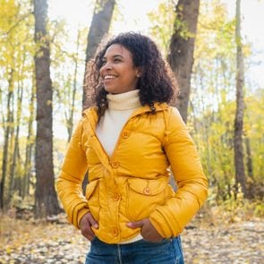 smiling woman outdoors in autumn on a sunny day