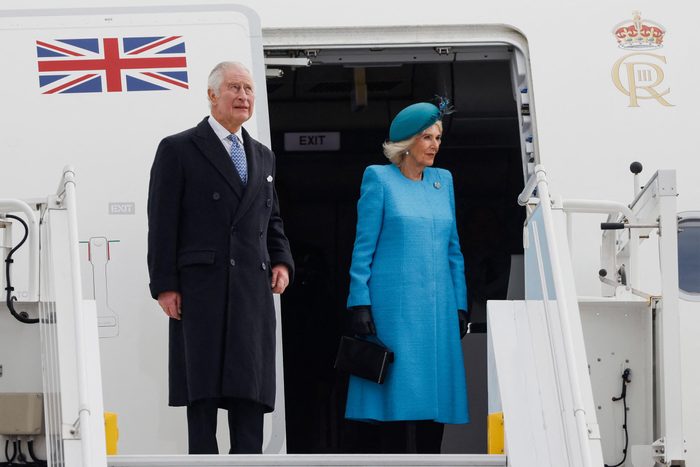 ritain's King Charles III (L) and Britain's Camilla, Queen Consort get off their plane after landing at Berlin Brandenburg Airport in Schoenefeld near Berlin, on March 29, 2023.