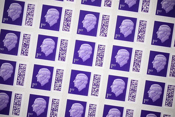 A sheet of the new first class stamps featuring a likeness of King Charles III is seen in a display case at the Royal Mail Museum on February 08, 2023 in London, England.