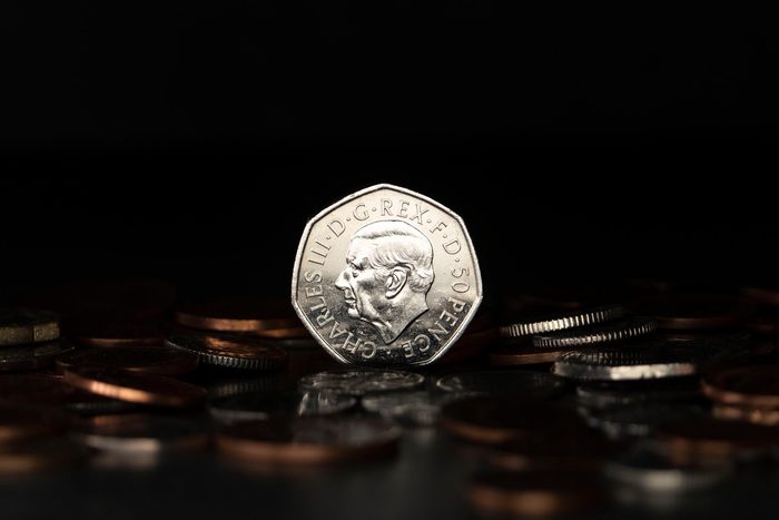 In this photo illustration, a British 50p coin with a portrait of a crowned King Charles III on April 14, 2023 in London, England.