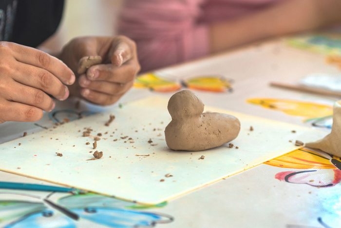 A Child Makes Clay Crafts With His Hands