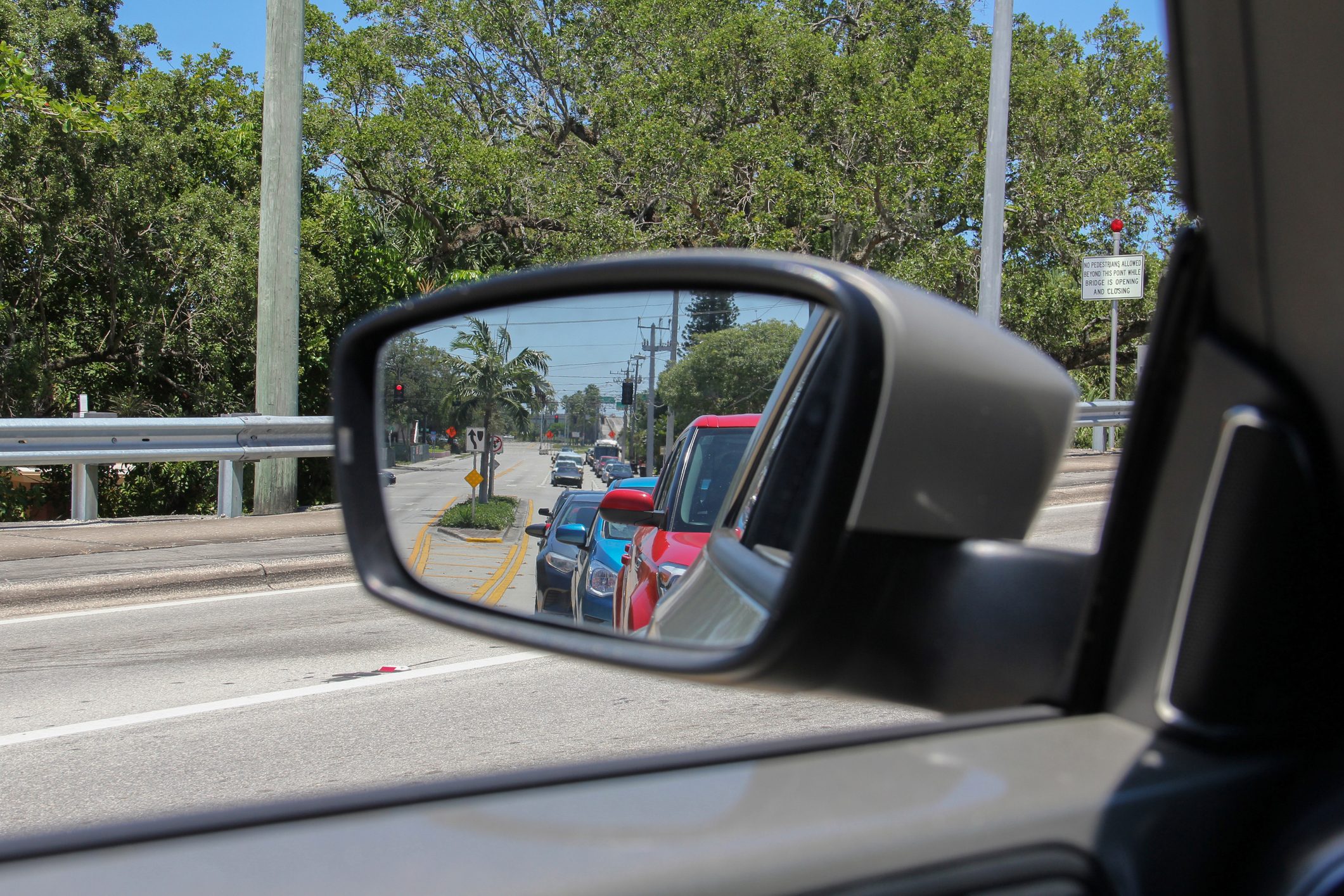 Traffic Reflected in Side-View Mirror