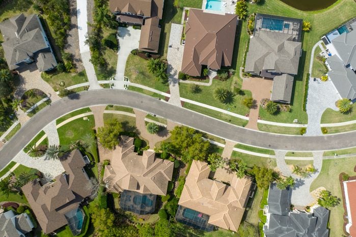 Suburban homes pictured by an overhead drone in an unknown city or suburban neighborhood
