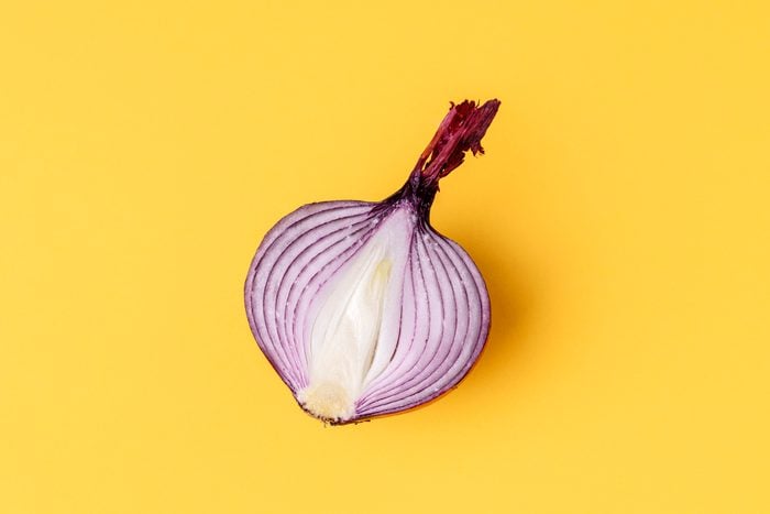 Half Red Onion On Yellow Background