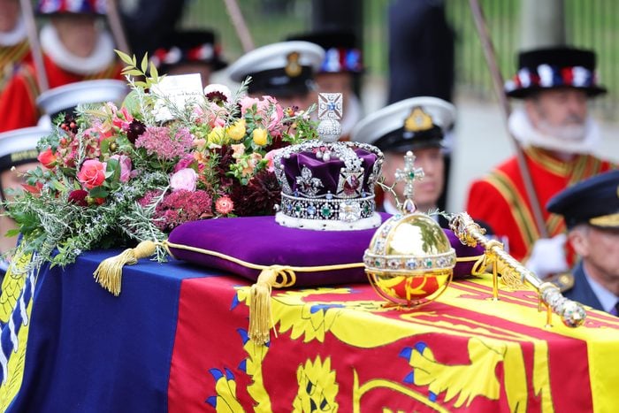 The coffin of Queen Elizabeth II with the Imperial State Crown resting on top is carried into Westminster Abbey on September 19, 2022 in London, England.