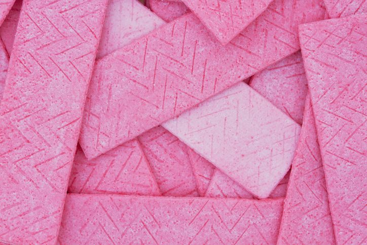 Sticks of Pink Bubble Gum Chewing Gum Piled on One Another to Fill Background