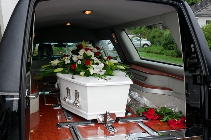a colorful casket in a hearse or chapel before funeral or burial at cemetery