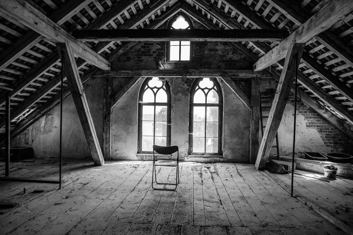 haunted house attic with a single chair