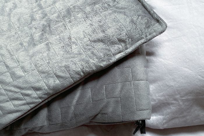 Gray Weighted Blanket In Bedroom