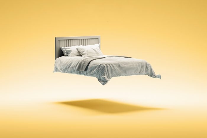 floating bed on yellow background