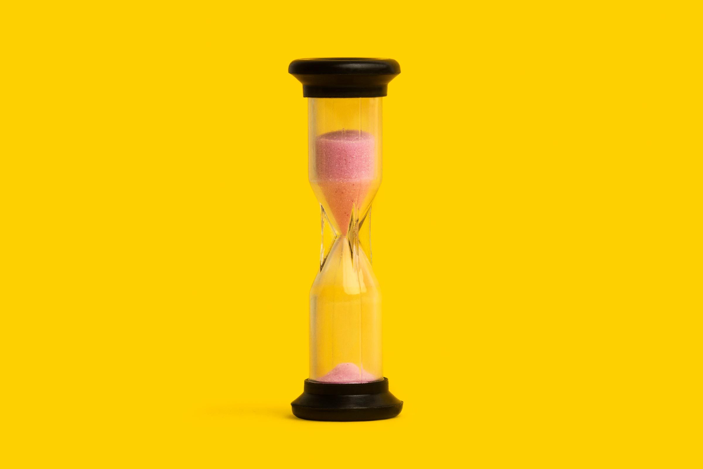 Hour Glass on yellow background