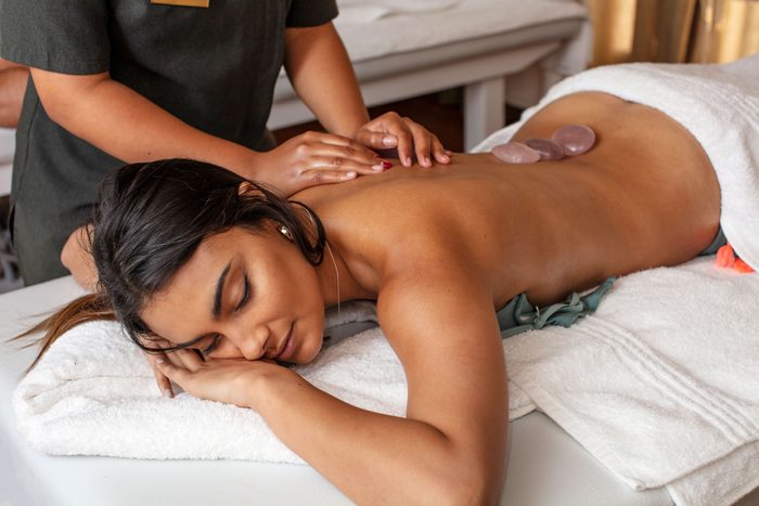 Woman receiving a massage in a spa and sleeping