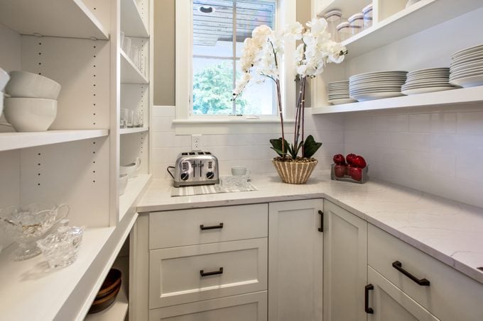 White cabinets and shelves in pantry