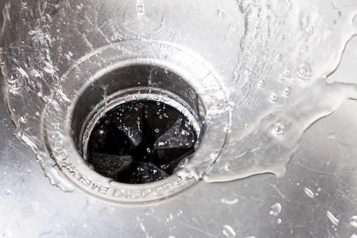 Kitchen sink garbage disposal with water going down