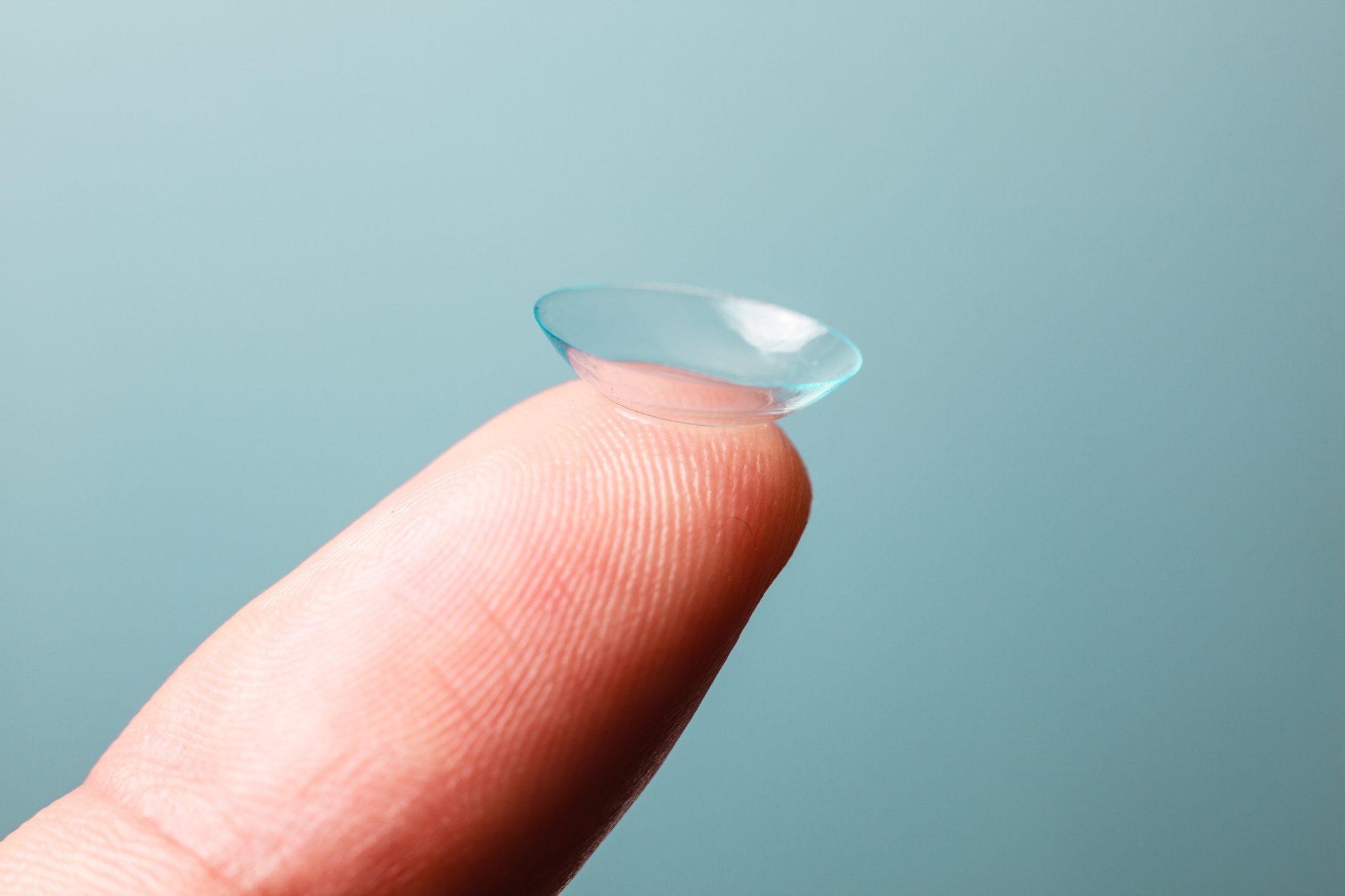 Contact lens balance on the tip of index finger