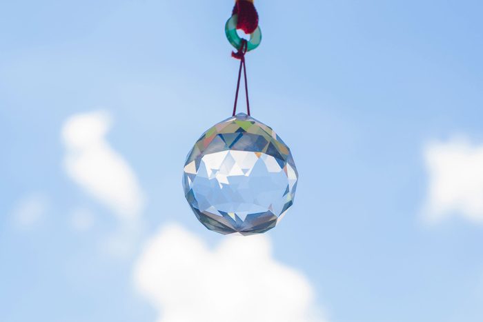 Hanging crystal ball and sky background