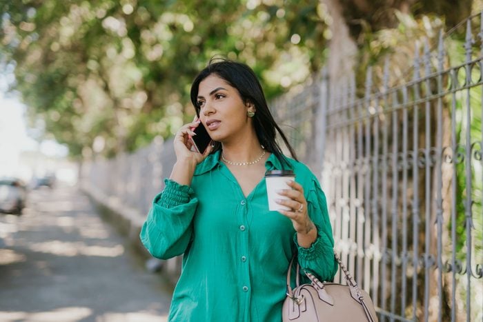 Woman On The Phone On Her Way To Work