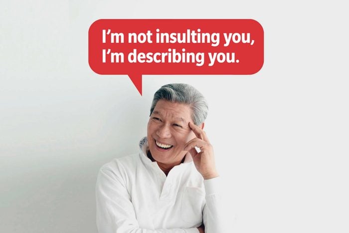 Laughing man delivering a comeback roast, speech bubble text: "I'm not insulting you, I'm describing you."