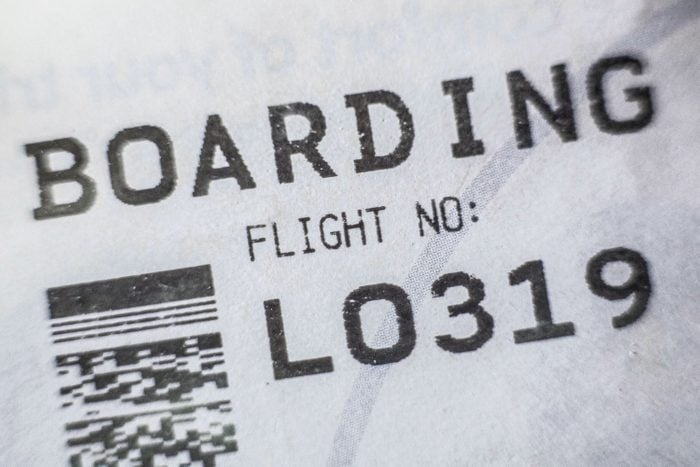 Boarding Pass Displaying Bar Code and Flight Number Seen in Airport in Warsaw