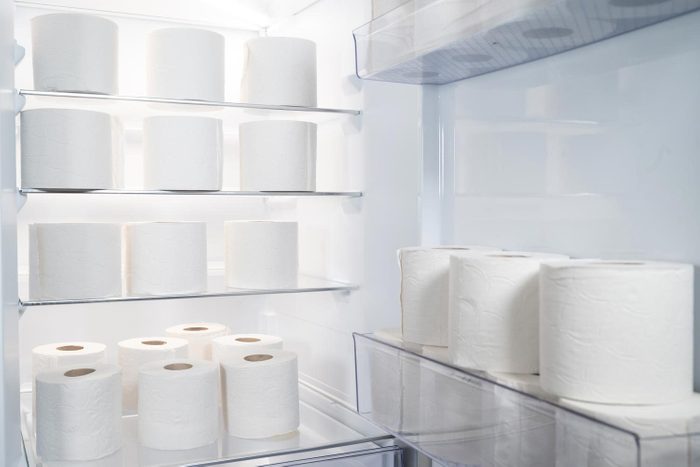 Open Refrigerator With Large Amount Of Toilet Paper Rolls Inside Humorous Storage Concept