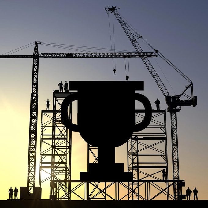 Trophy icon construction site silhouette with cranes and steel structures