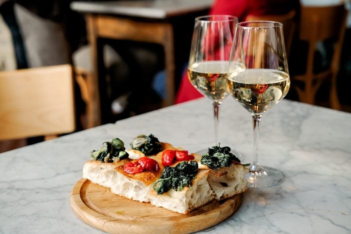 Food Italian style bruschetta with tomatoes and glasses of white wine
