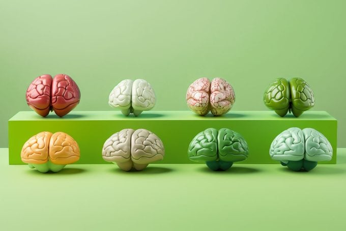 eight different colored brains on green background