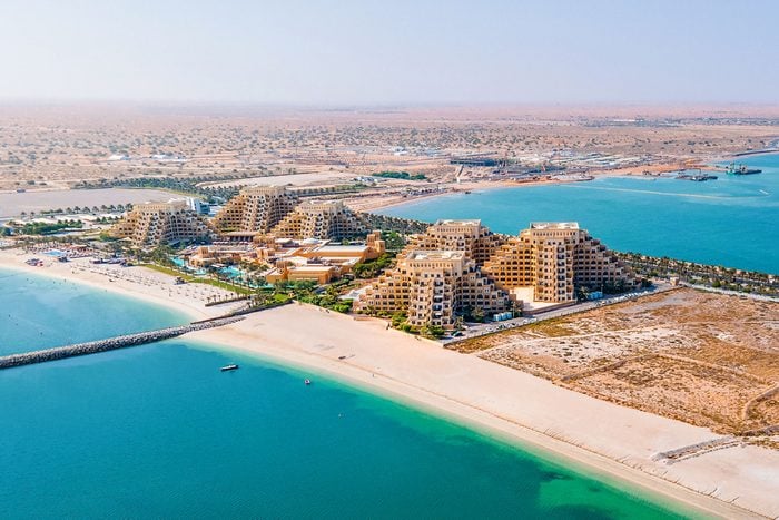 Aerial View Of Beach Road And Resorts Of Marjan Island In The Emirate Of Ras Al Khaimah In United Arab Emirates