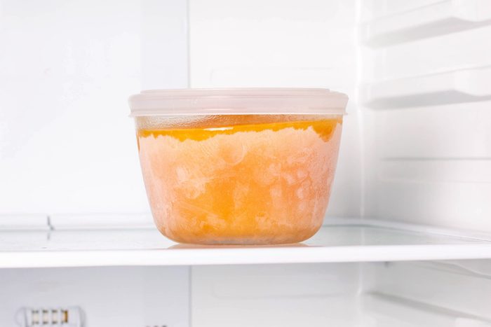 Frozen pumpkin soup in the refrigerator. Frozen food. Frozen soup.