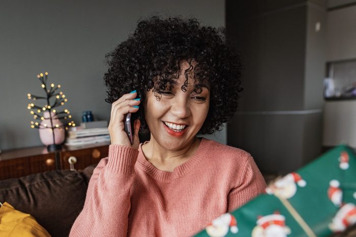 Woman talking on the phone during Christmas