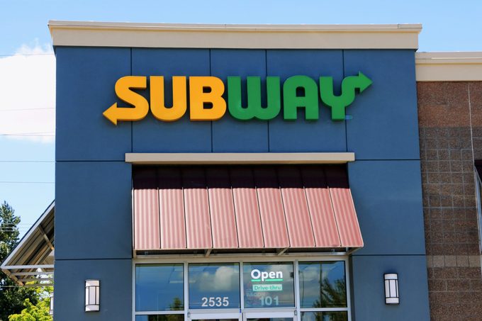 Subway sandwich shop sign above store entry