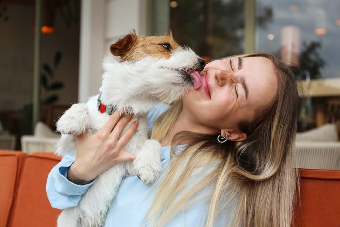 dog licking girls face