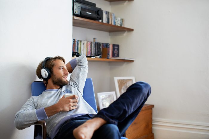 man listening to the radio at home