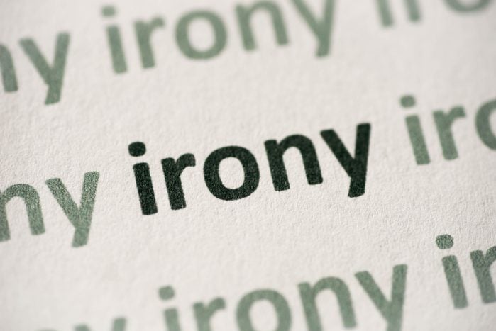 word irony printed on paper macro