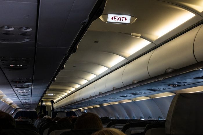 cabin lights and exit sign inside airplane