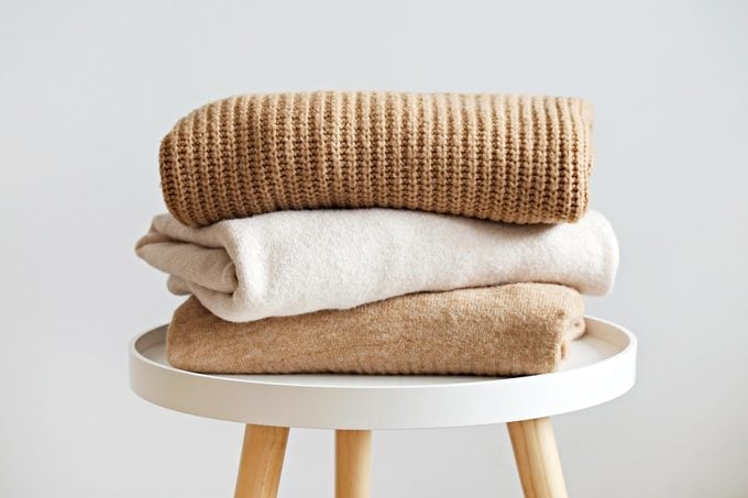 Stack of three sweaters