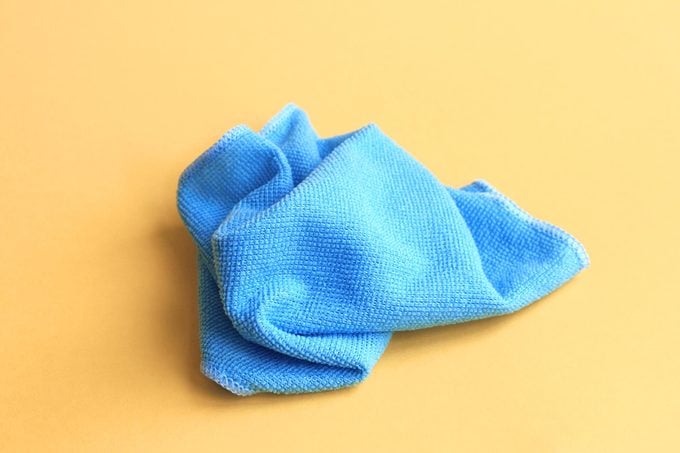 blue microfiber cloth on yellow background