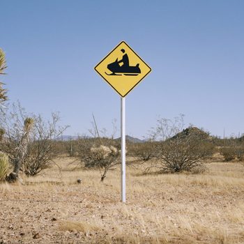 Snowmobile warning sign in desert