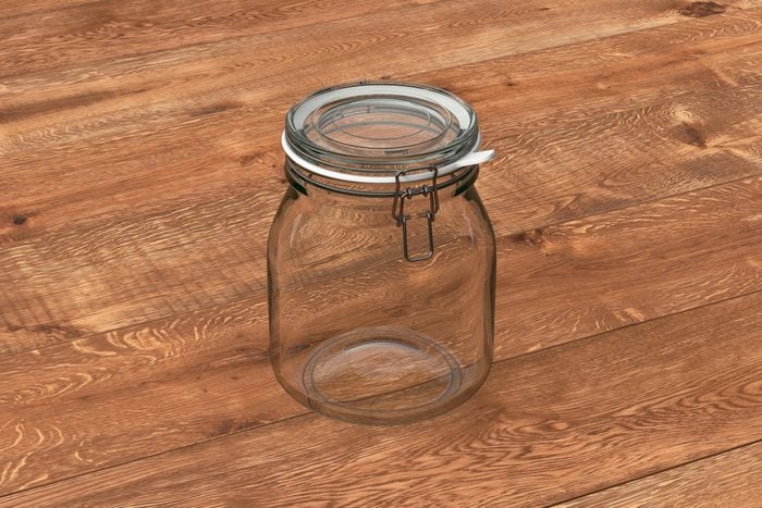 Empty glass jar with clamp lid